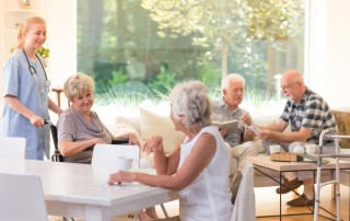 seniors gathered together in senior living facility