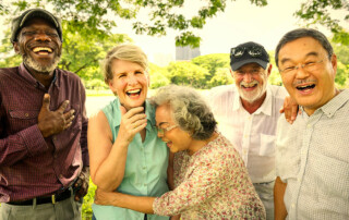 Group of 5 seniors, men and women, laughing and smiling