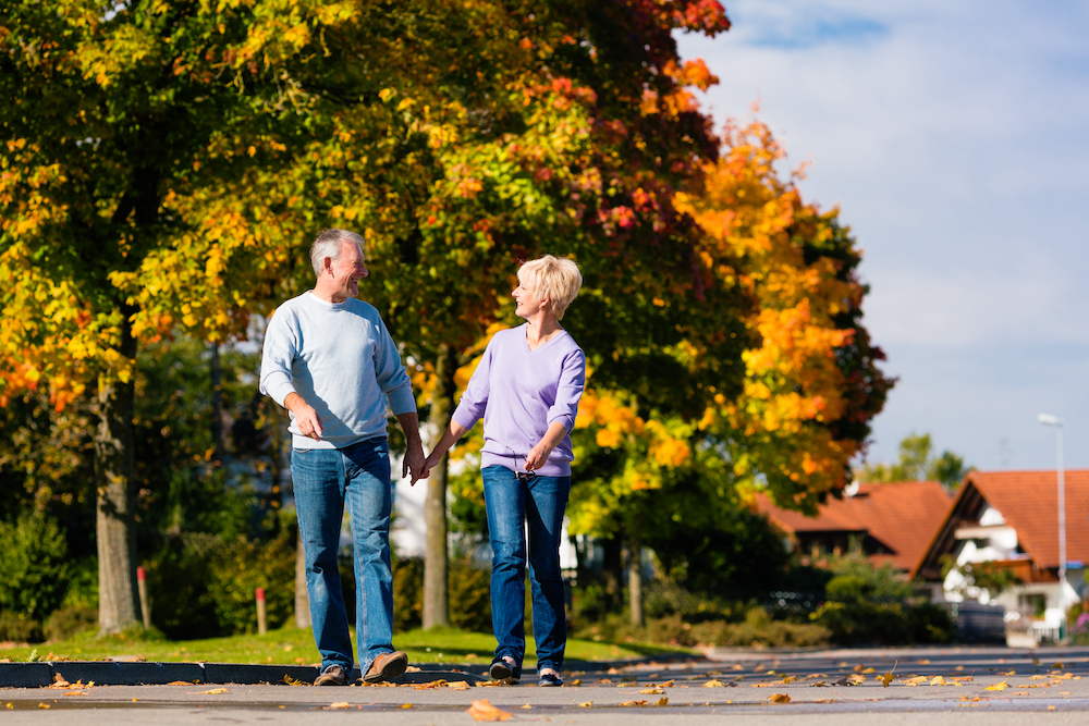 A senior couple out on a walk on a fall afternoon
