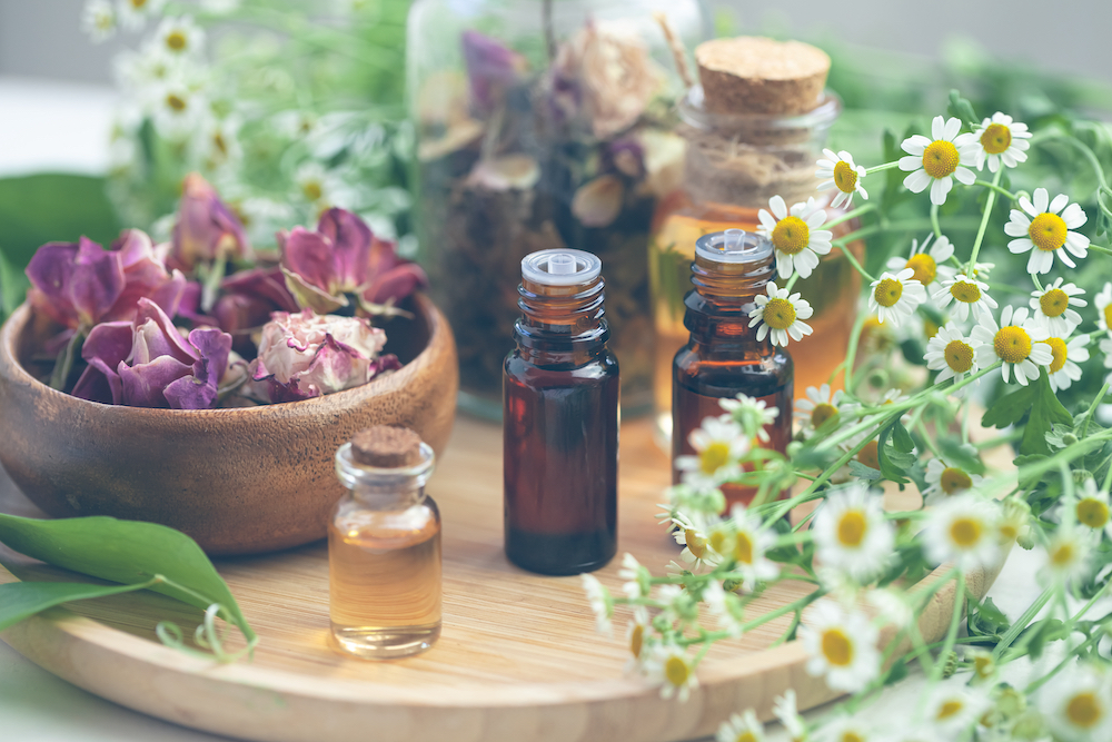 An arrangement of flowers and essential oils